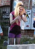 Avril Lavigne Pics beehive hairdo black fishnet stockings filming photo shoot inside The Viper Room nightclub Hollywood