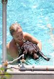 Hayden Panettiere celebrates her 19th birthday wearing itty bitty gold bikini and donned a purple party hat while hanging out with some female friends in the pool