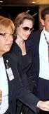 th_66824_Preppie_-_Angelina_Jolie_arrives_into_Miami_International_Airport_-_Feb._7_2010_877_122_912lo.jpg