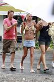 Tara Reid in a bikini top and denim mini